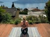 A woman sits on an R-YOLO yoga mat in Switzerland.