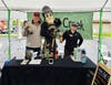 Wildcat Creek Winery owner Nyssa Craton and her employee, Brent Russell, pose with Purdue Pete. 