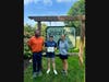 Nyssa Craton, owner of Wildcat Creek Winery, holds recognition presented by Josh Klumpe and Nicole Cowen of the Humane Society for Greater Lafayette for her winery’s help in hosting adoption events and soliciting donations. 