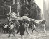 Dragon dancers parade down Bayard Street and Mott Street