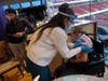 SANTA CLARA, CA - MARCH 03: Emil Hopner, 103, gets his second COVID-19 vaccination from licensed vocational nurse Maria Petel Budrewicz at Levi’s Stadium on Wednesday, March 3, 2021. To the left is Hopner’s son Ben Hopner.