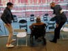 SANTA CLARA, CA - MARCH 03: Emil Hopner, 103, center, waits with his son Ben Hopner, left, and Glenn Bartkoviak of guest services, after getting his second COVID-19 vaccination at Levi’s Stadium on Wednesday, March 3, 2021.