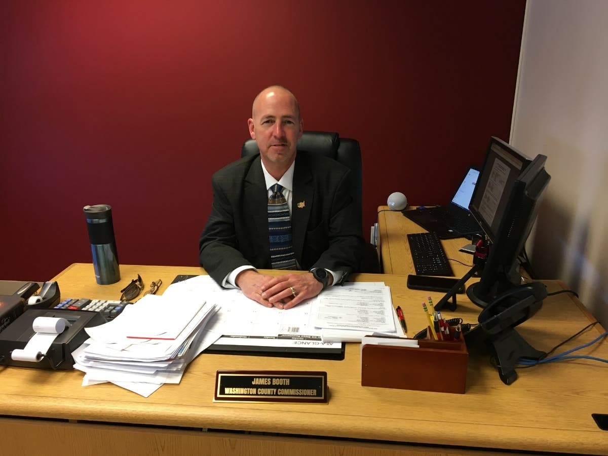 An image of Washington County Commissioner James Booth in his office.