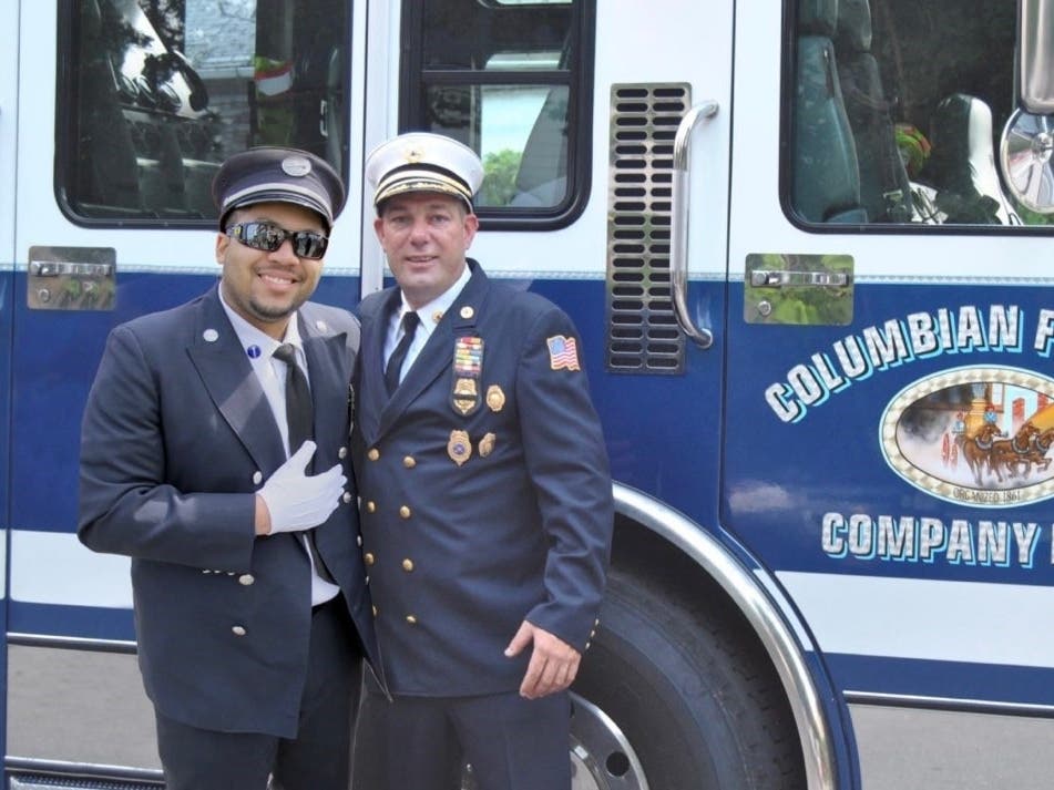 Jared Lloyd pictured with his former Columbian Fire Engine Company No. 1 Chief Mike Johnson.