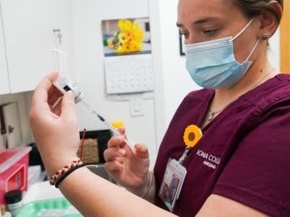 Iona College nursing student Anna Tesoriero ’21, of Huntington, draws a COVID-19 vaccine. In all, students will vaccinate 550 residents over six sessions in New Rochelle.
