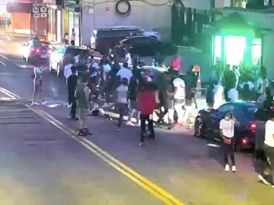 Police say the violence was witnessed by at least 50 people. 