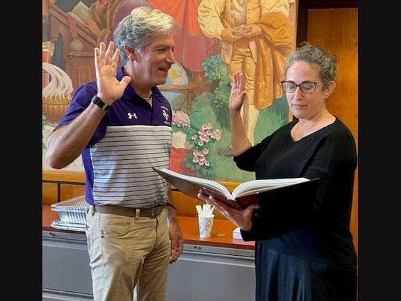 Jonathan P. Raymond is sworn in as Superintendent of the City School District of New Rochelle by Board of Education President Julia Muggia Ochs.