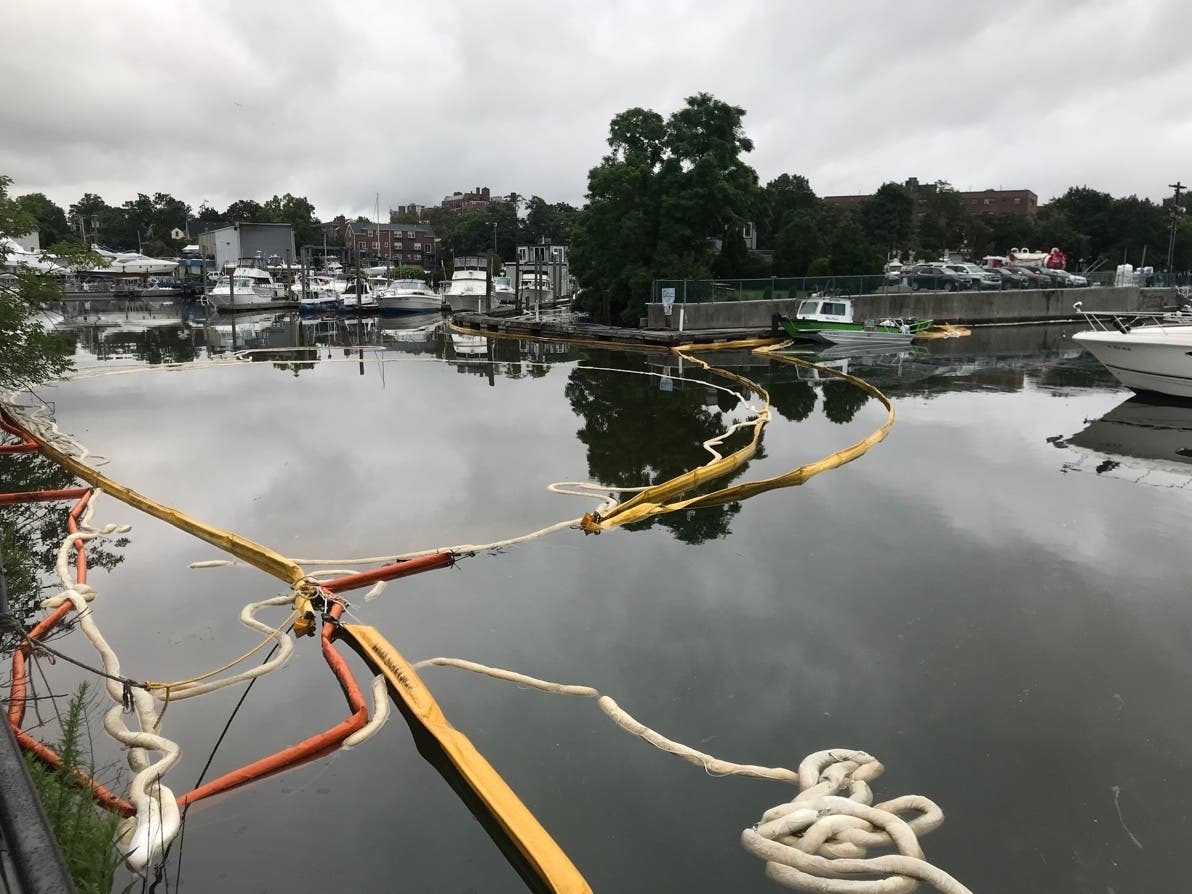 Crews rushed to limit the spread of an oil leak on the Long Island Sound shore. 