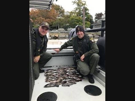 ECOs Wamsley and Tompkins with seized fish.