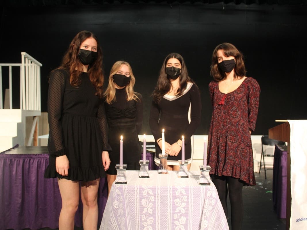 The ceremony included officers of John Jay's chapter: Pres. Kaitlyn Varriale, Vice Pres. Alyson Parker, Secretary Jessica Kennedy & Treasurer Amanda Alber, lighting a candle for the society's core values: scholarship, leadership, service and character. 