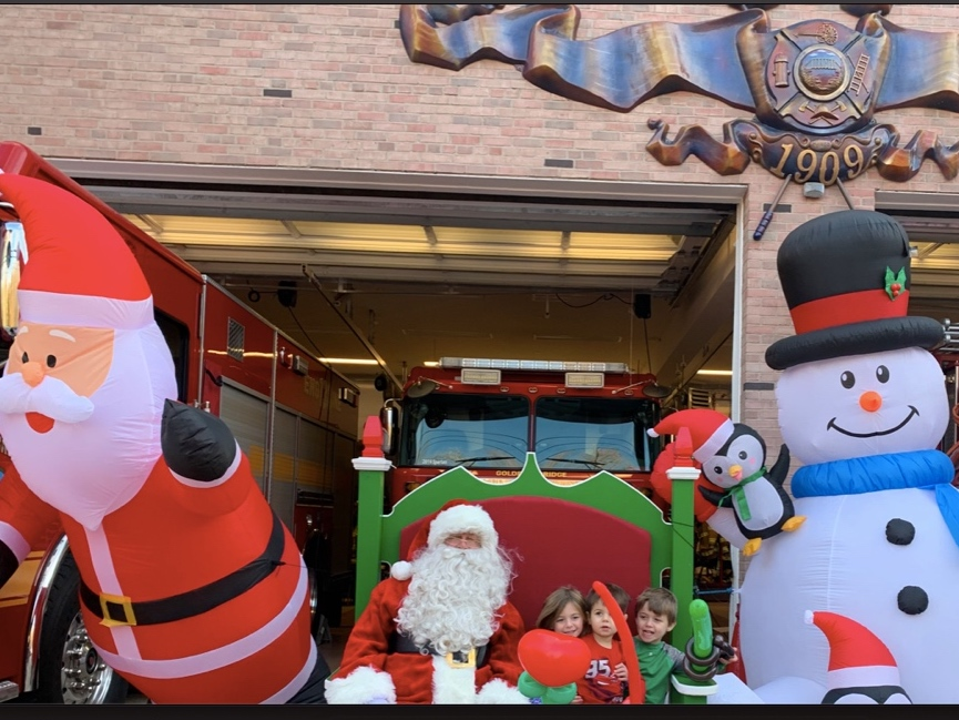 Children got to try out Santa's special bench, said to be from the North Pole, at the curbside children's holiday event at the Golden's Bridge Firehouse.
