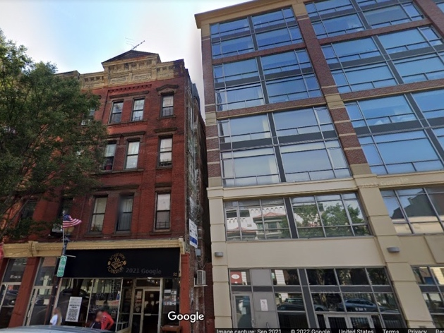 During the confrontation at the residential building on Main Street, an officer fell from the third-floor landing to the second-floor landing approximately ten feet below, resulting in serious injuries to his head, back and spine.