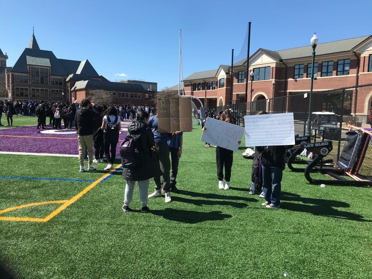 Students held signs that read, "Protect Your Students," "No Means No" and "No Never Means Yes" on Monday. 