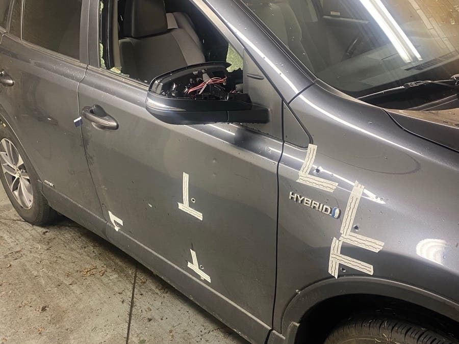 Bullets riddled the delivery truck. 
