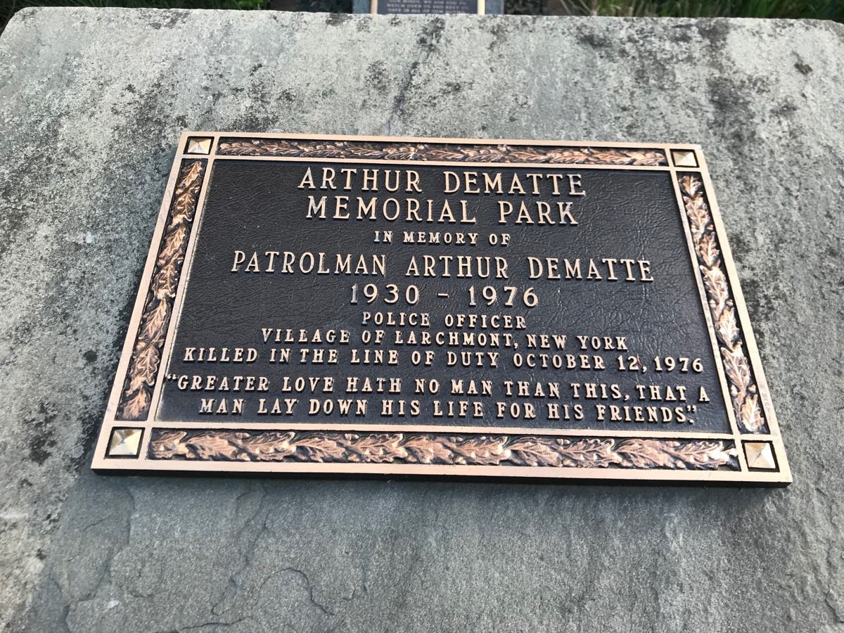 The words on the plaque honoring Patrolman Arthur DeMatte read, "Greater love hath no man than this, that a man lay down his life for his friends."
