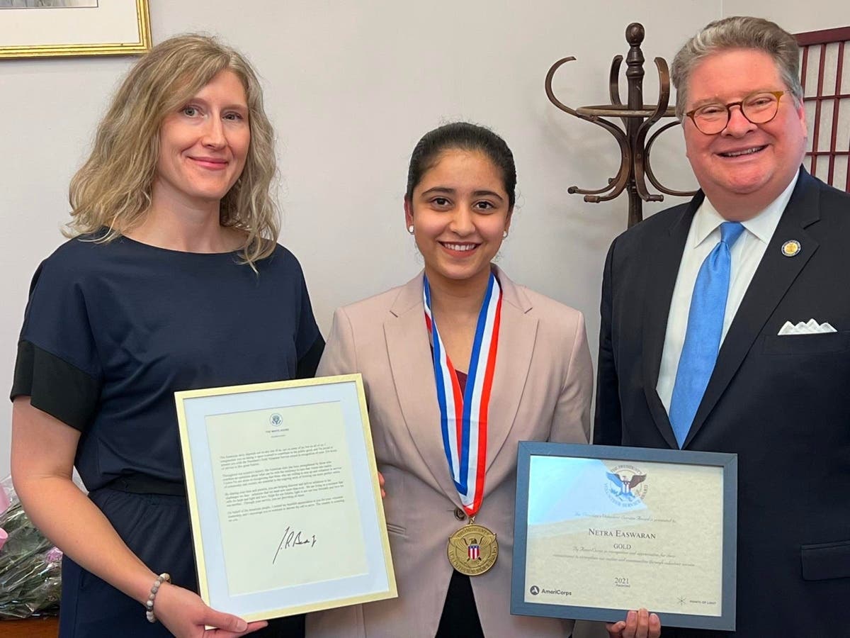 Netra Easwaran receiving the Gold President's Volunteer Service Award from Sen. Peter Harckham and Jennifer Castelhano. 