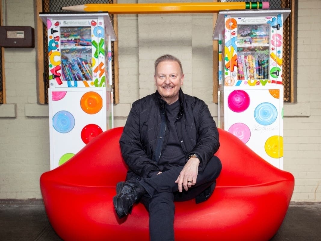 Artist Charles Fazzino pictured here at the Pop-Up Library he designed for the New Rochelle Train Station. 