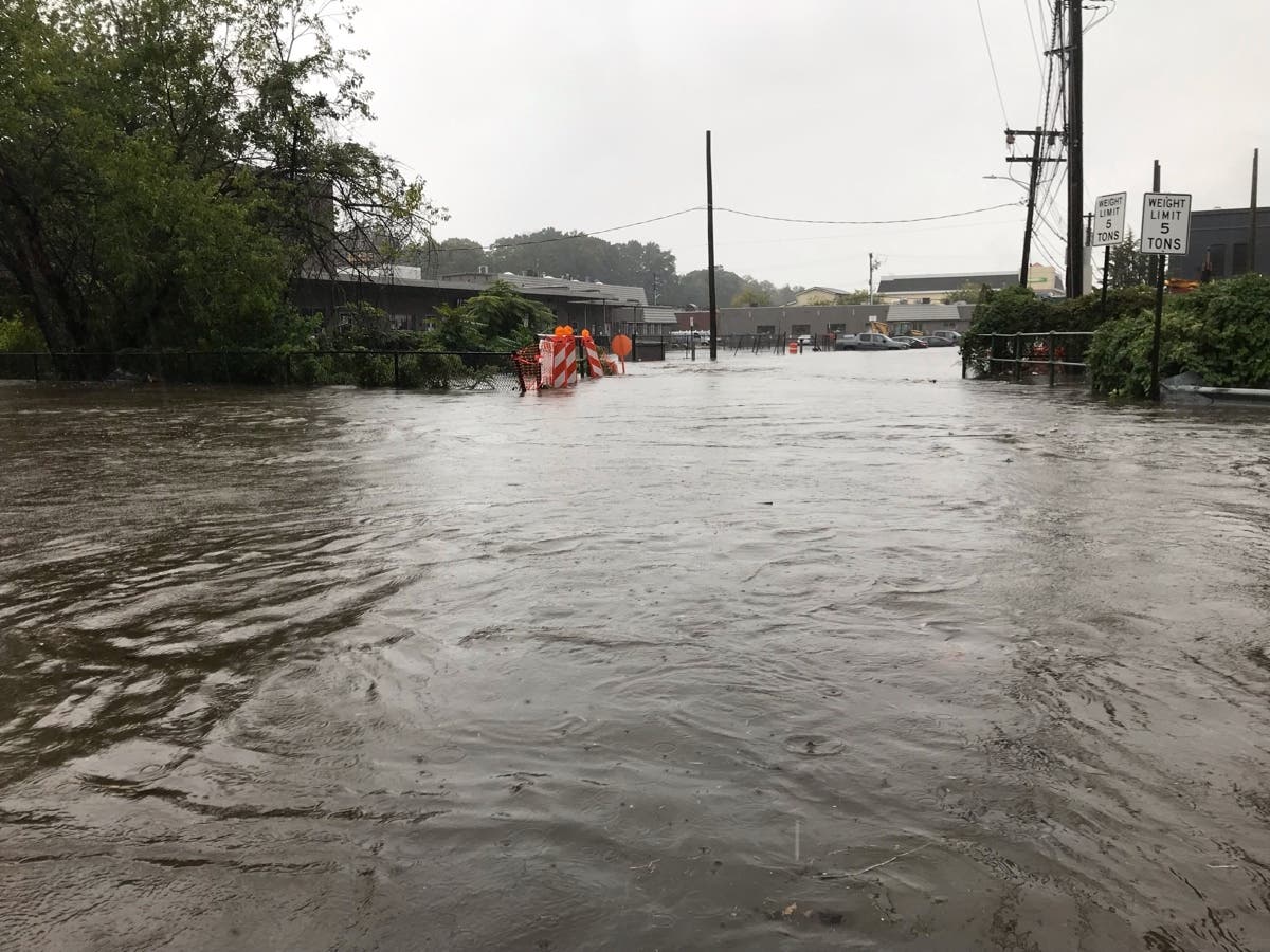 A bridge replacement project that is key to plans to mitigate potentially deadly flooding has been stymied over a disagreement over who will pay for traffic control.