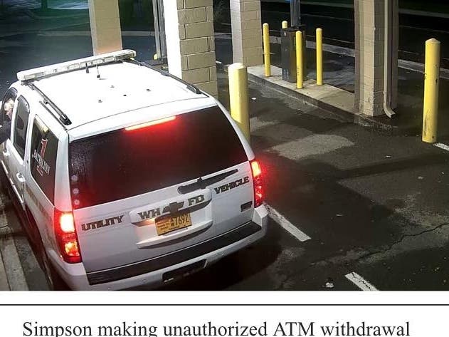 The former financial secretary is seen here making an unauthorized withdrawal. 