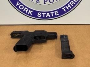 During a vehicle inventory, troopers found a loaded semi-automatic 9mm handgun, with 10 rounds of ammunition in the magazine, on the floor of the back passenger seat, according to NYSP.