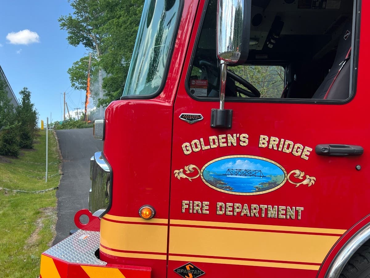The Golden’s Bridge Fire Department said the initial dispatch came in at 3:16 p.m. for downed power lines and a brush fire at Green Hill Road and Green Lane.