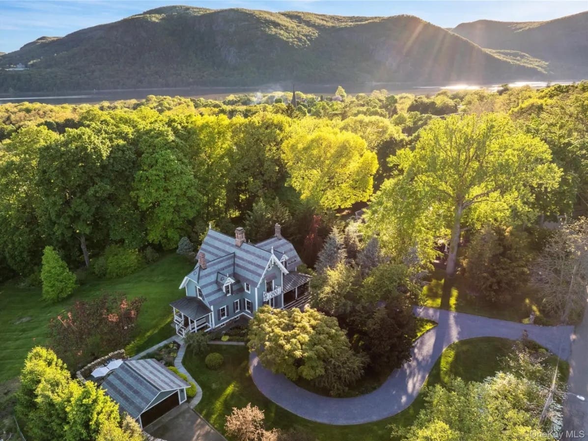 The 4-bedroom, 3.5 bathroom, 2,967-square-foot Gothic Victorian, built in 1865, and recently restored, features a hand-scalloped slate roof, and "grand proportions befitting a true historic compound."