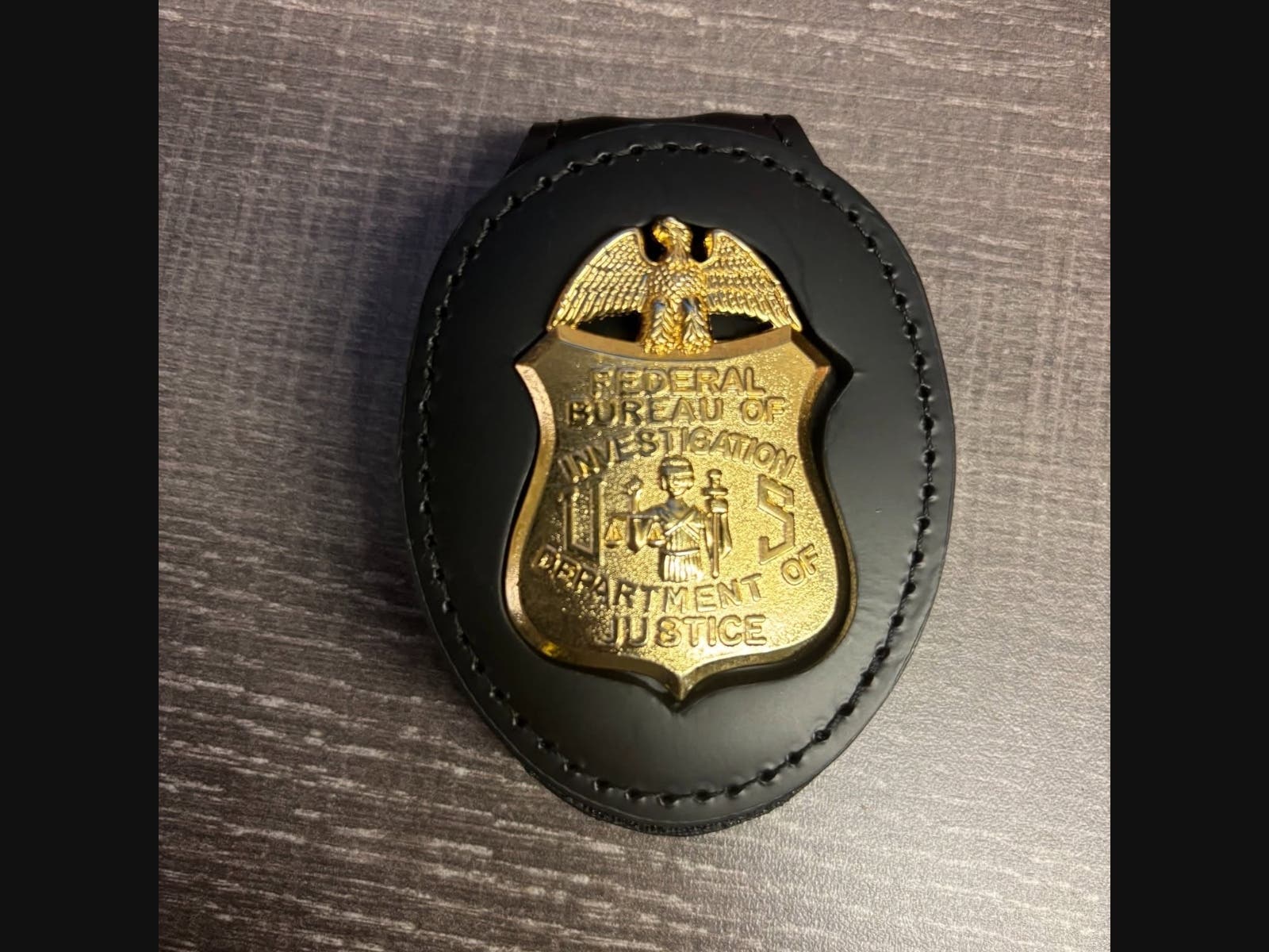 Westchester County police say that the man raised his shirt to show them a gold shield at his waist. He told the officers that he was "FBI," and that he and the dog had recently been shot in the line of duty.