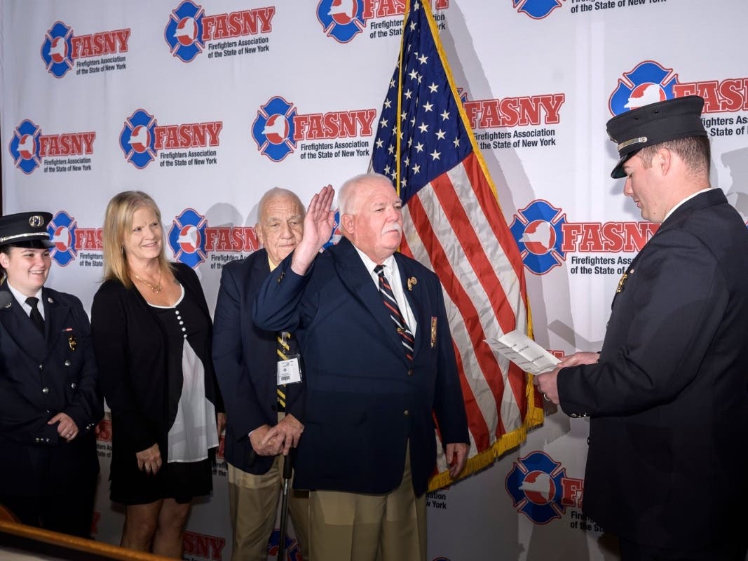 Farrell took the oath of office from his son, Daniel Farrell, an Ossining firefighter, as family members and volunteer firefighters from around the state watched.
