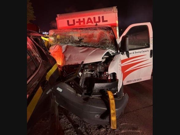 The U-Haul box truck traveling westbound struck the rear of the marked State Police troop car, causing it to strike the second police vehicle, according to NYSP.
