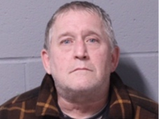 The 58-year-old's arrest followed the execution of a search warrant. The investigation involved allegations of stalking several victims over a period of several years.