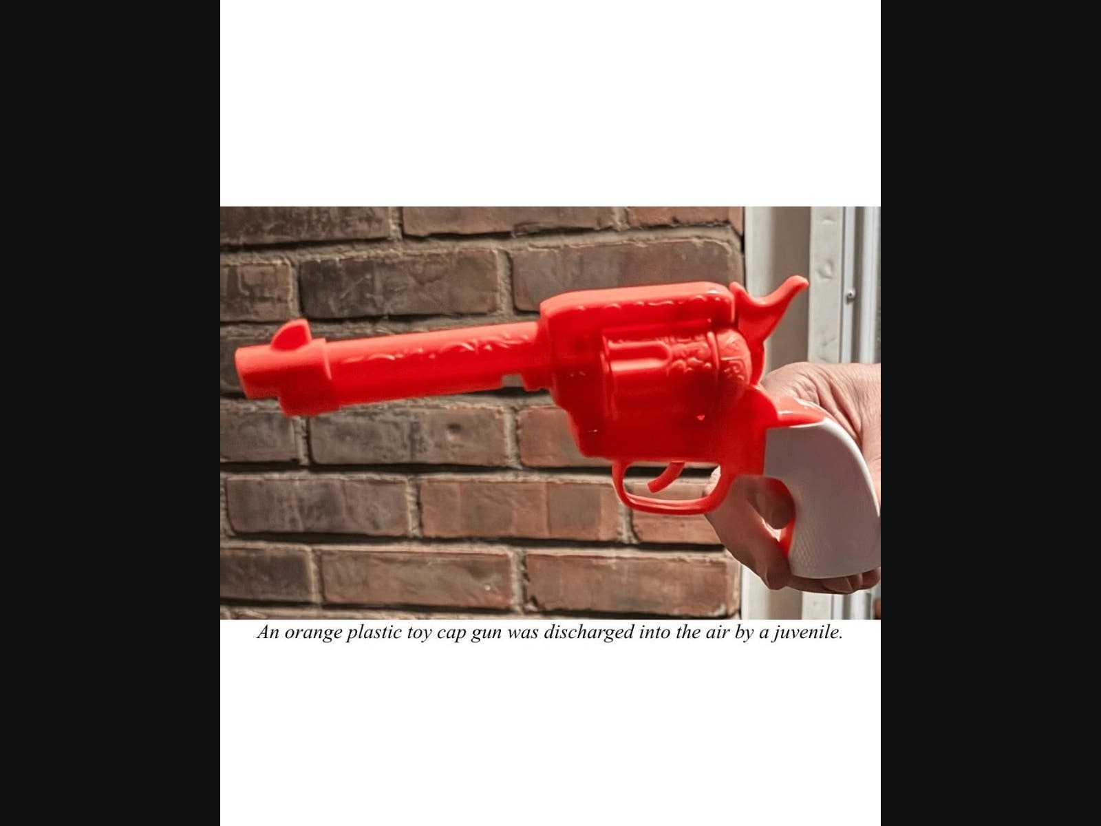 Police determined that a juvenile had discharged a bright-orange plastic toy cap gun into the air.