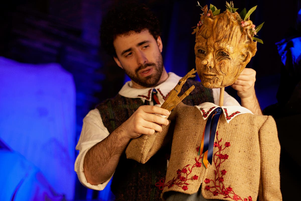 Sean Garratt (voicing and puppeteering Pinocchio) and the puppet Pinocchio, created by Chicago Puppet Studio. 