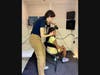 RV staff placing headphone on child