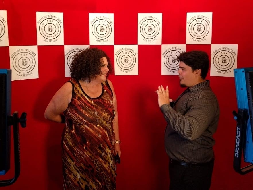 Comedian Vicki Barbolak being interviewed by Sterling Anno of KOCT TV at the Oceanside International Film Festival.