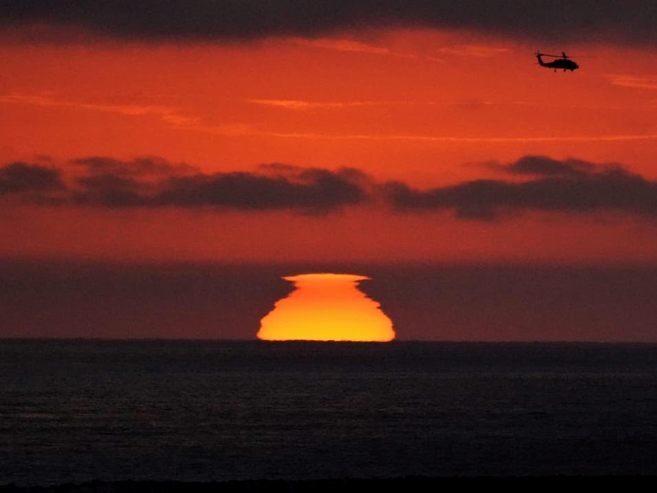 Coastal sunset chopper heading north toward Camp Pendleton