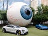 Event Held at Iconic Eye Sculpture Featured the Porsche Chalk Turbo S and a Neptune Blue 4S.