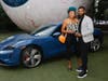 Candace Hampton and Keshaun Fudge enjoy seeing the Porsche Taycan at the Eye.