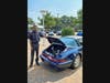 Park Place Porsche Dallas technician Seantrel Sloan with restored 1990 Porsche 911 Carrera 4 Targa, which won first place in Area and Regional competitions before placing in the top 3 in the Porsche Classic Restoration Challenge national championship.