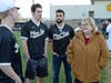 PESH alumni (L-to-R) class of 2018 Braden Stroud, Sam Alvey and Roshan Damodaran talk with former PESH baseball coach Rusty Franklin’s widow Anne Franklin.