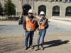 DBI Superintendent Santos Gorrostieta with Laborer Lucia Trujillo in front of Dallas Records Building