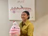 Amber Garrison, Park Place Dealerships Marketing Director, shows off the Squishmallow plush toy Abby will receive. 