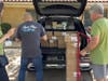 A parade of Park Place Dealership vehicles departed from The Vitamin Bridge's Coppell headquarters to deliver one million doses of vitamins. 