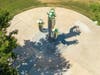 Ariel view to show ground shadows of the sculpture of Bloom Where You’re Planted.
