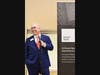 Sam L. Susser addresses guests at the grand opening of Susser Bank's new branch in Plano. 