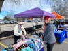 Alliance volunteers passing out hats and mittens at last year's event.
