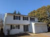 Although the spruce (behind house) and cedar (rt.) are large, they don't endanger this house. Huge white pine trees often do. If that is puzzling, then discuss it with an arborist, who can evaluate trees and explain the concept of "relative risk" to you.