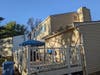 The back deck has been in disrepair and hazardous for years, at 18923 Quail Valley Boulevard. Weeds grow in the gutter. It's not clear whether the HOA has taken any action at all to notify and warn the landlord about his decaying property. 