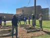 Pastor Lisa Telomen leads the group in prayer after the installation of the garden.