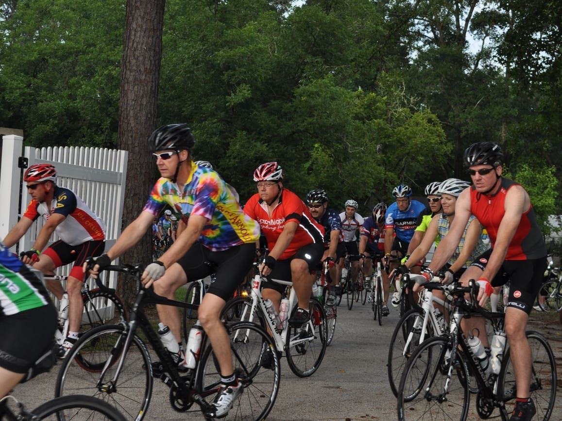 Cyclists ride their bikes as part of the Burn Your Buns Bike Ride on July 4. The ride, which followed a course through Willis and Conroe, raised over $12,000 for Bridgewood Farms, which helps people with intellectual and developmental disabilities.