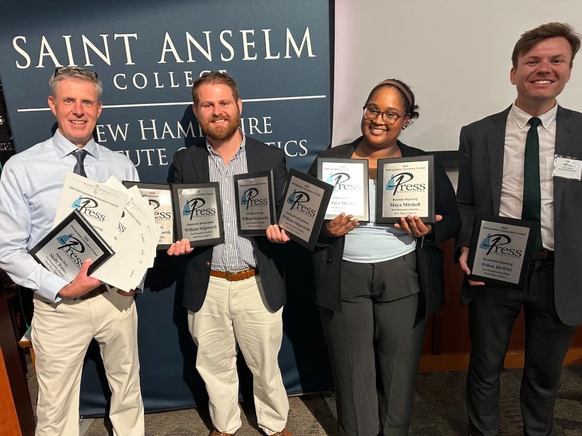 From left, Bulletin editor Dana Wormald and reporters William Skipworth, Maya Mitchell, and Ethan DeWitt celebrate at the New Hampshire Press Association annual award ceremony at the New Hampshire Institute of Politics at St. Anselm College in Manchester.